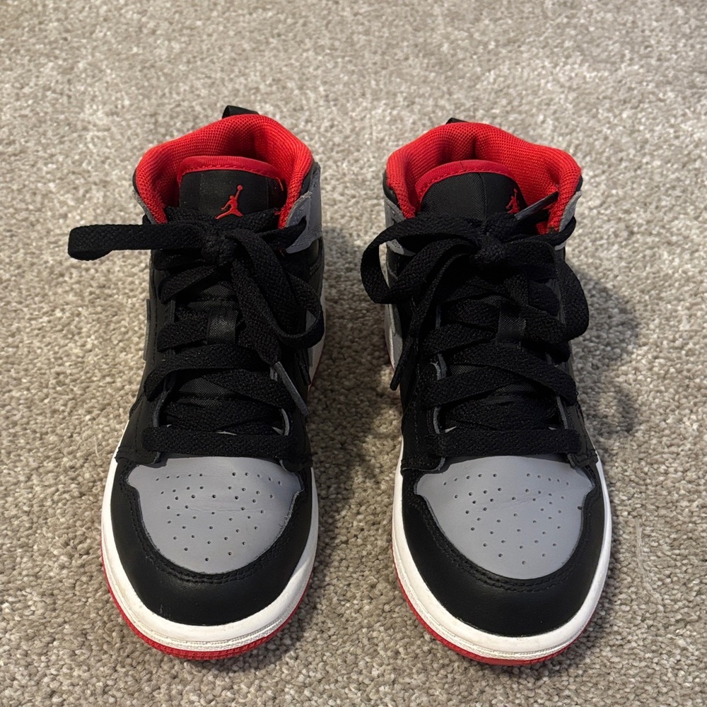 Black and Gray High-Top Sneakers with Red Accents